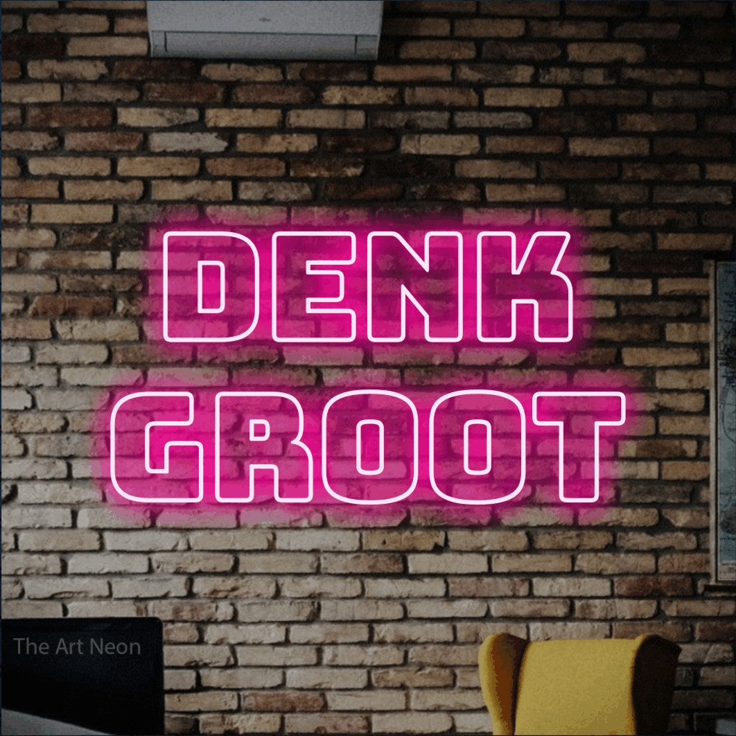 LED neon sign reading “DENK GROOT”, arranged in 2 lines.
