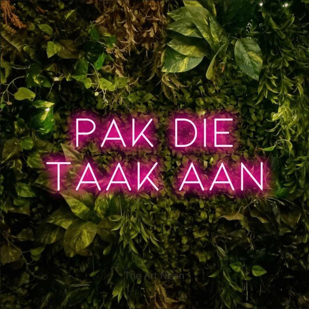 LED neon sign reading “pak die taak aan”, arranged in 2 lines.