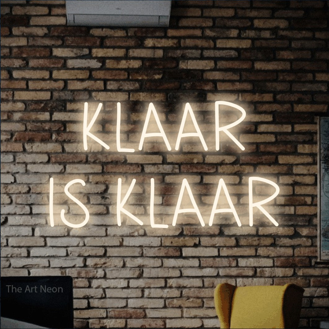 LED neon sign reading “KLAAR IS KLAAR”, arranged in 2 lines.
