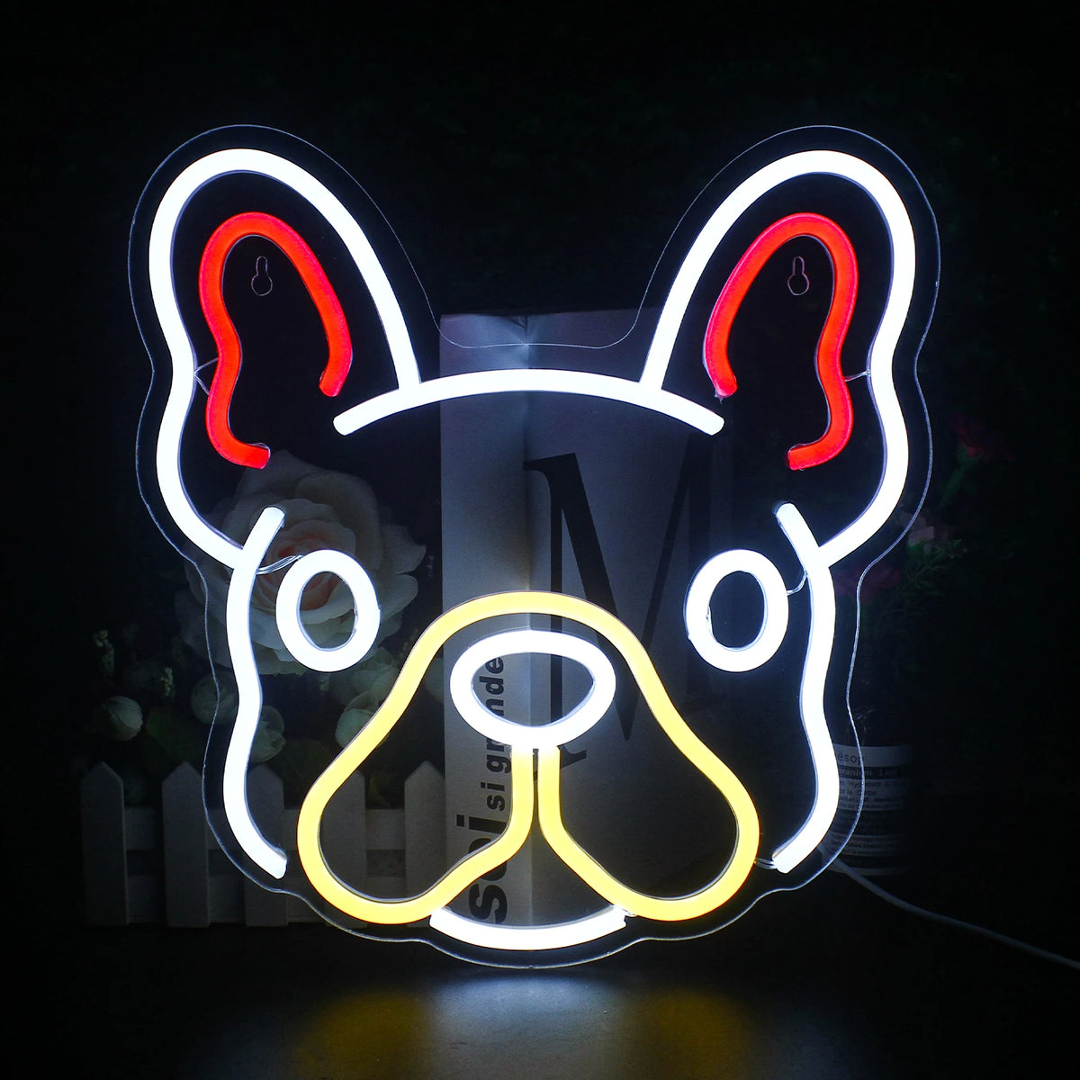 A colorful, handmade LED neon sign in the shape of a cute dog is prominently displayed.