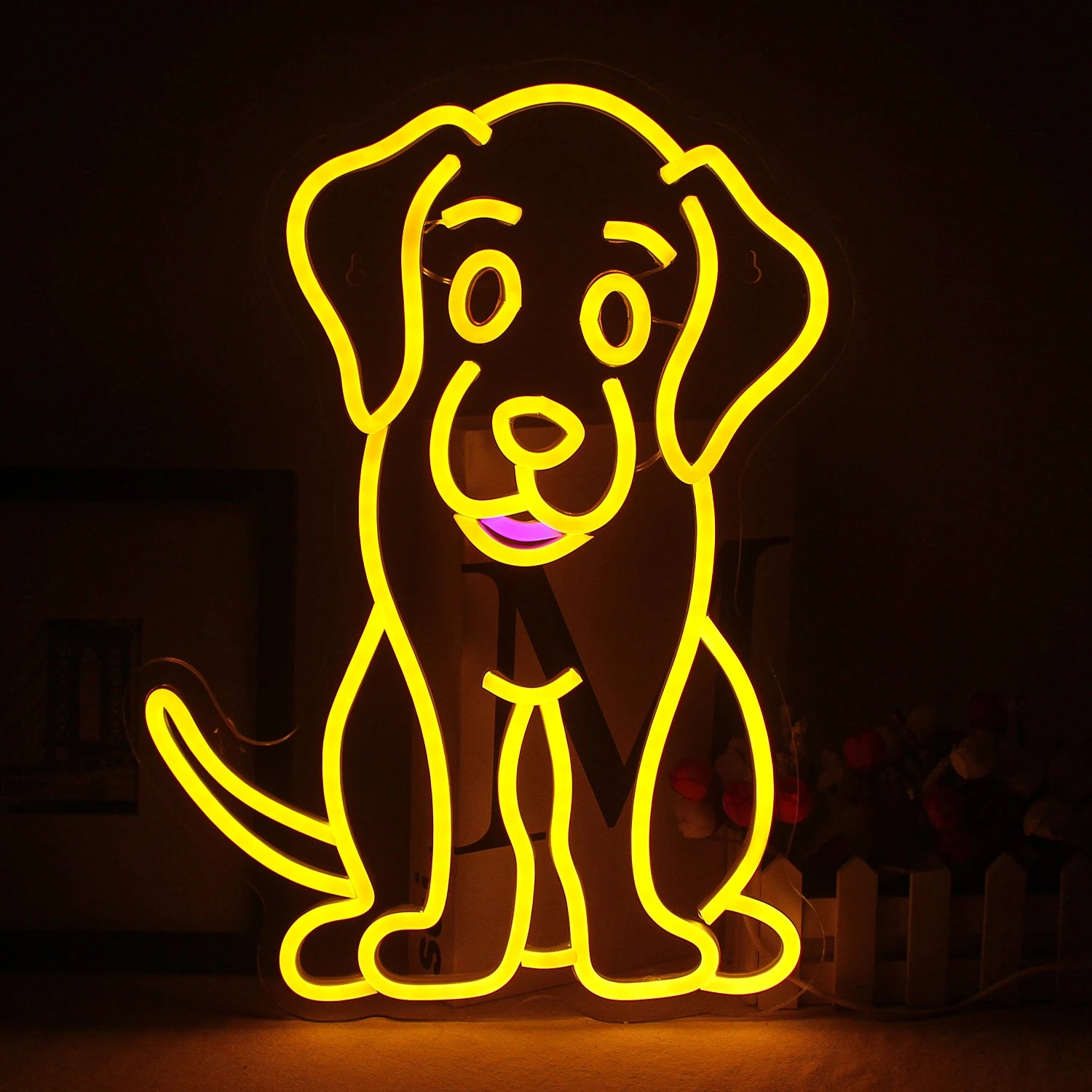 The image showcases a vibrant LED neon sign in the shape of a dog's silhouette.