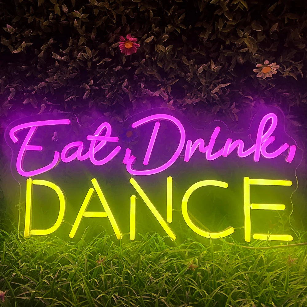Op de afbeelding is een levendig, handgemaakt LED-neonbord te zien met de tekst "Eat Drink Dance" in een levendig lettertype.