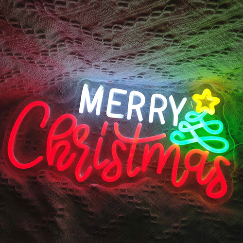 De afbeelding toont een levendig, handgemaakt LED-neonbord waarop in elegant, vloeiend schrift de tekst "Merry Christmas" staat.