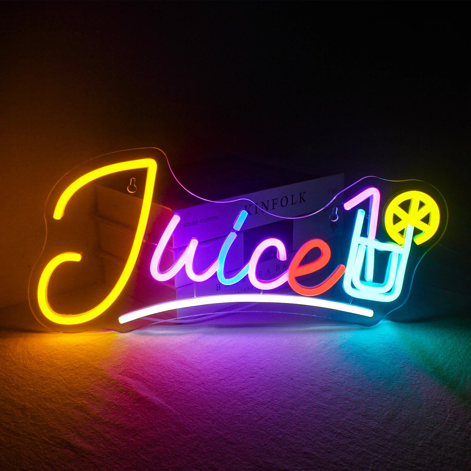 "Image showing a vibrant LED neon sign in the shape of a juice cup, featuring a straw and whimsical splash elements.