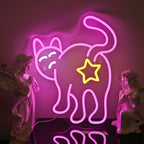 The image shows a cat-shaped LED neon sign emitting a warm, yellow glow.