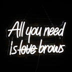 Op de afbeelding is een levendig LED-neonbord te zien met de tekst "All you need is brows".
