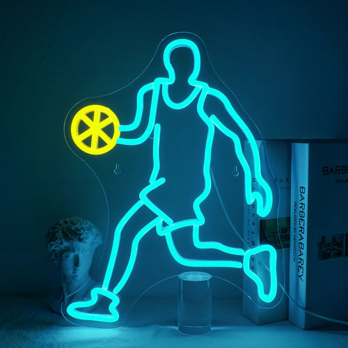 A vibrant LED neon sign depicting a bright orange basketball with clear, distinct lines showing its panels.