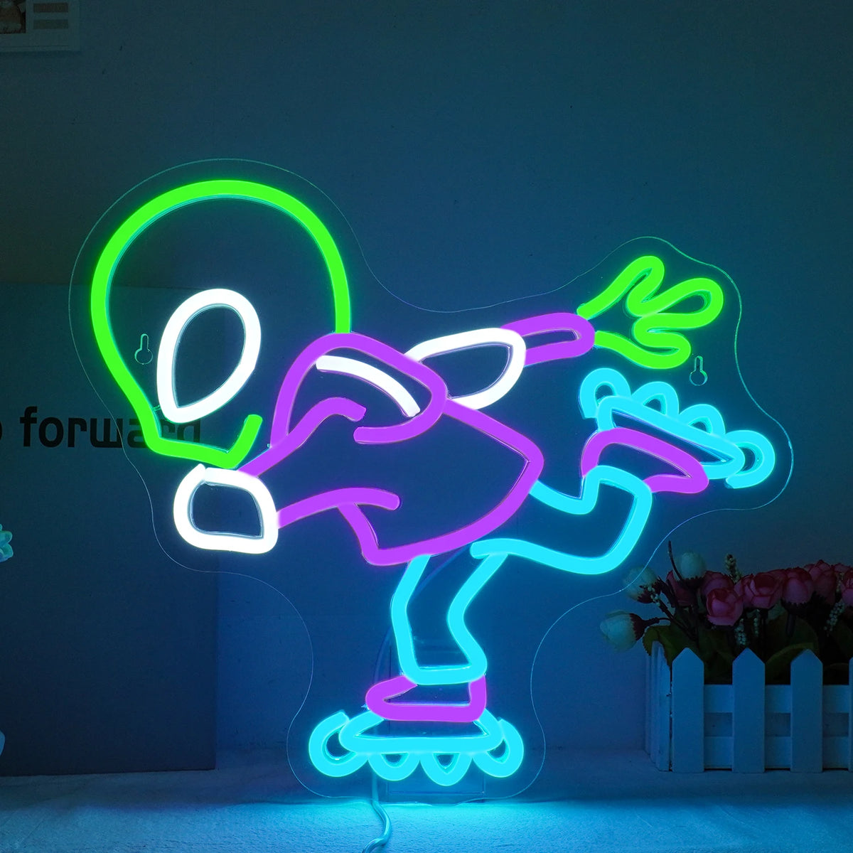 Een levendig Alien LED-neonbord met de klassieke vorm van een buitenaards hoofd en grote, ovale ogen.