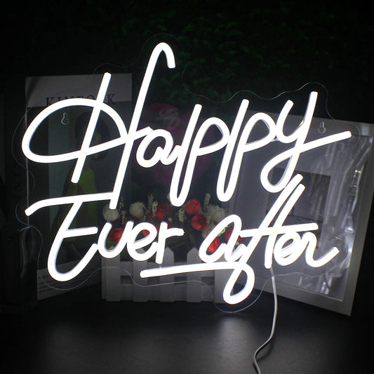 A vibrant LED neon sign spells out the phrase "Happy Ever After" in elegant, cursive lettering.