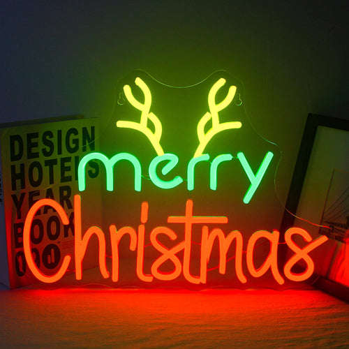 Op de afbeelding is een handgemaakt LED-neonbord te zien, waarop in een elegant, vloeiend lettertype de tekst "Merry Christmas" staat afgebeeld.