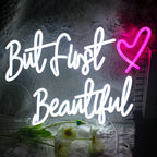 The image features a handmade LED neon sign displaying the phrase "But First".
