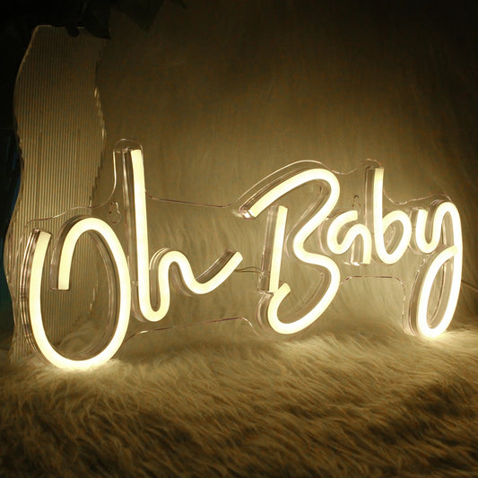 A vibrant "Oh Baby" LED neon sign featuring elegant, cursive lettering.