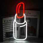 The image displays a vibrant, handmade LED neon sign in the shape of a lipstick.