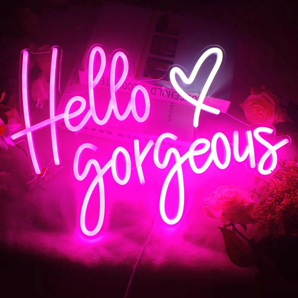 The image features a handmade LED neon sign displaying the words "Hello Gorgeous" in elegant, cursive script.
