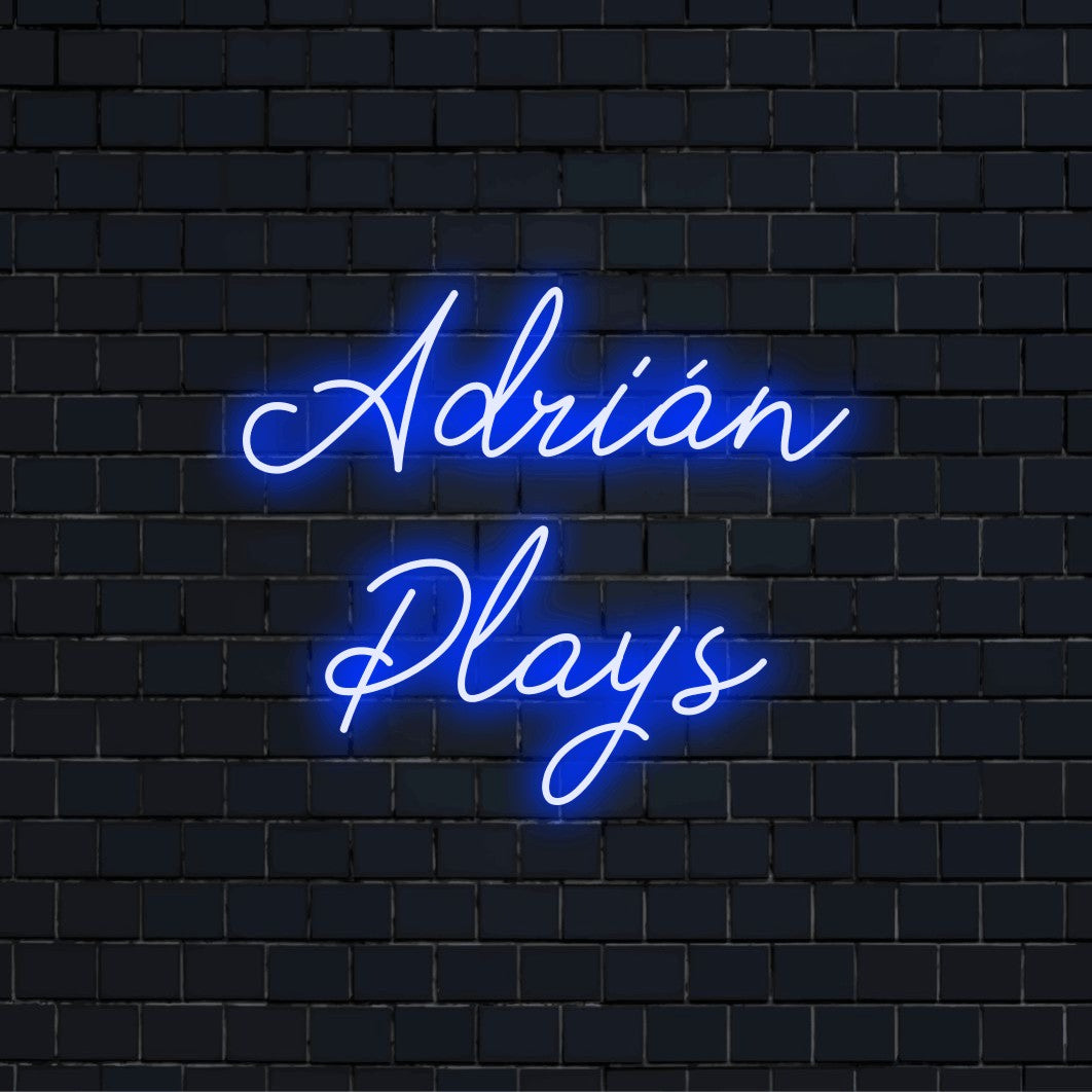 Adrian Plays Custom Name Neon Sign, glowing lettering against brick backdrop