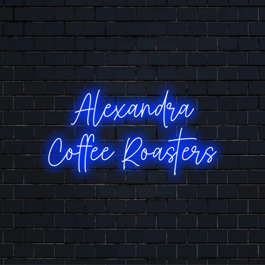 Alexandra Coffee Roasters Personalized Neon Light with glowing wall decor on black brick background