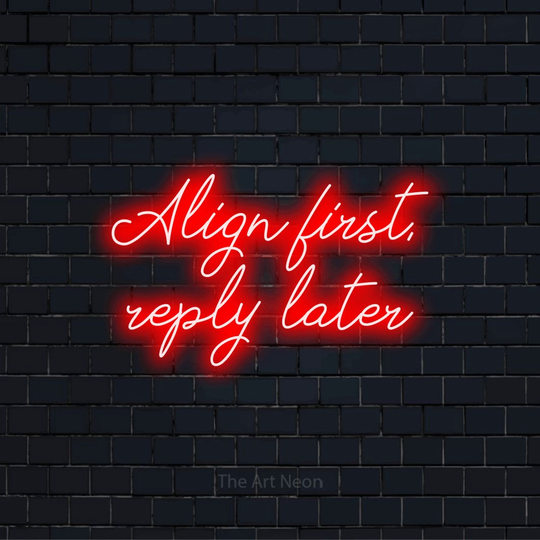 "Align First, Reply Later" script-style LED neon sign on a black brick wall