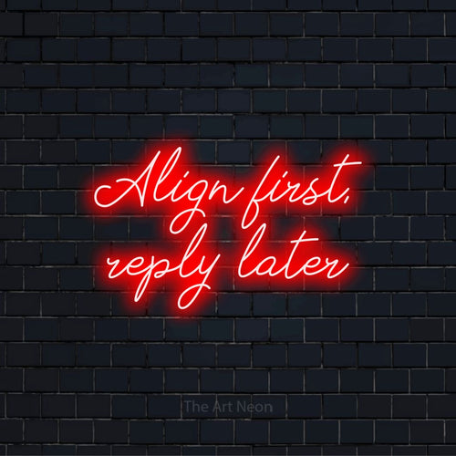 "Align First, Reply Later" script-style LED neon sign on a black brick wall