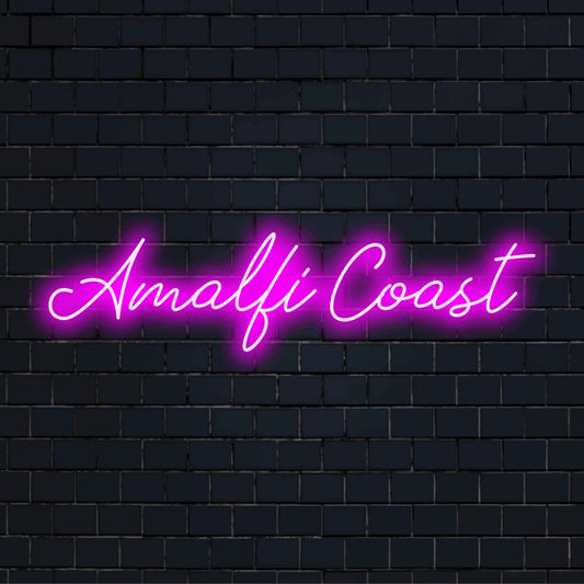 Amalfi Coast Neon Sign, glowing lettering on dark brick background