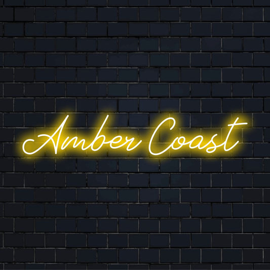 Amber Coast Neon Sign, bright neon glow against brick backdrop