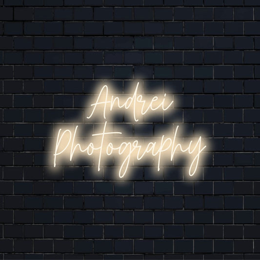 Andrei Photography Personalized Neon Light with bright neon lettering against brick backdrop