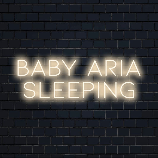 Baby Aria Sleeping Personalized LED Neon Sign, bright neon glow against brick backdrop