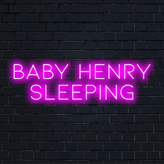 Baby Henry Sleeping Personalized Neon Light with bright neon glow on dark brick wall