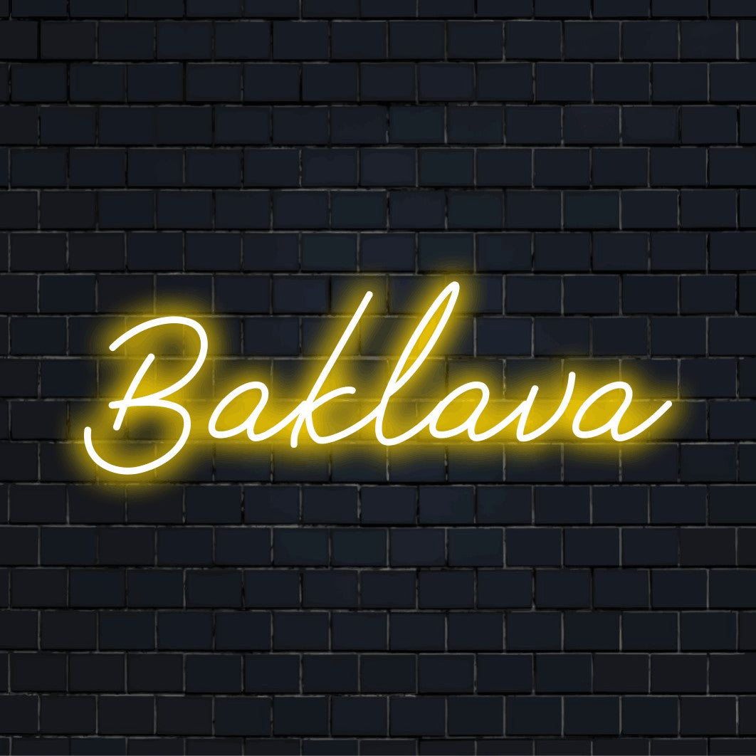 Baklava Neon Light with bright neon lettering against brick backdrop