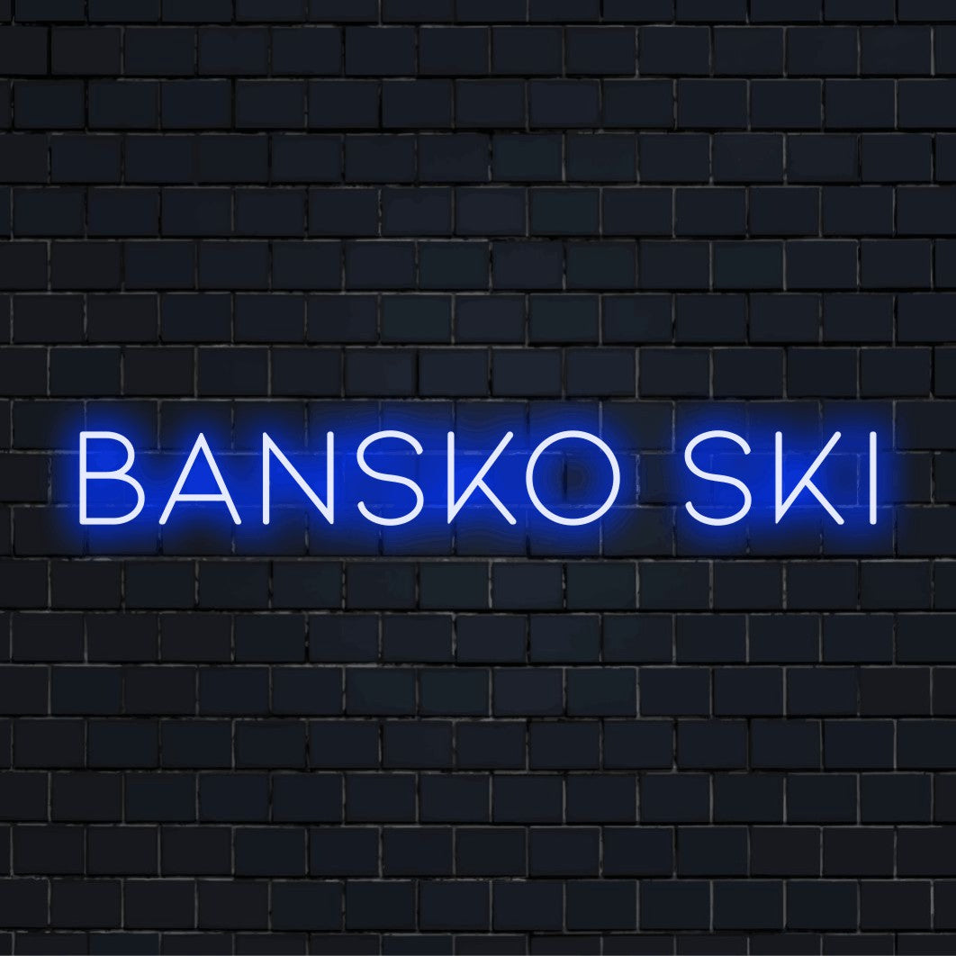 Bansko Ski LED Neon Sign, glowing wall decor against black brick wall