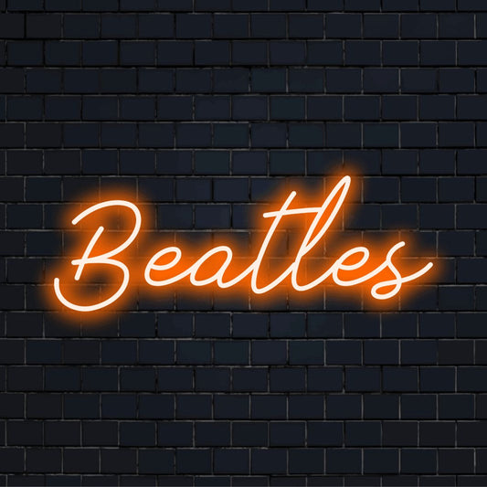 Beatles LED Neon Sign, glowing wall decor on dark brick wall