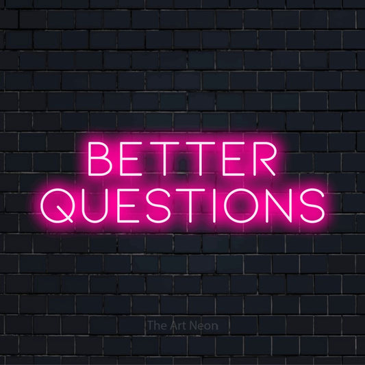 "Better Questions" LED neon sign on a black brick wall