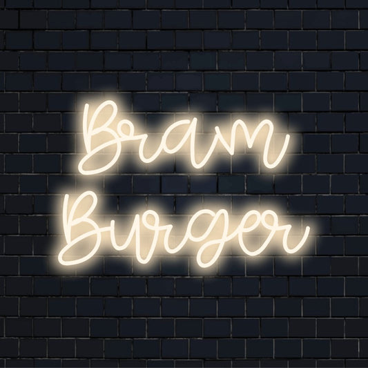 Bram Burger Personalized Neon Light with glowing wall decor against brick backdrop