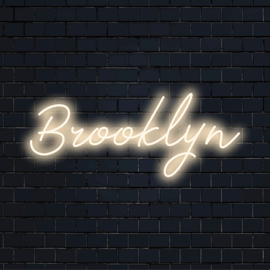 Brooklyn Neon Sign, neon text light on black brick background