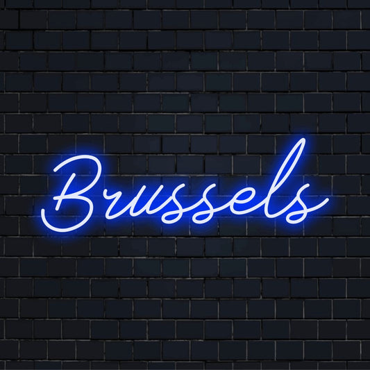 Brussels Neon Sign, glowing lettering against black brick wall