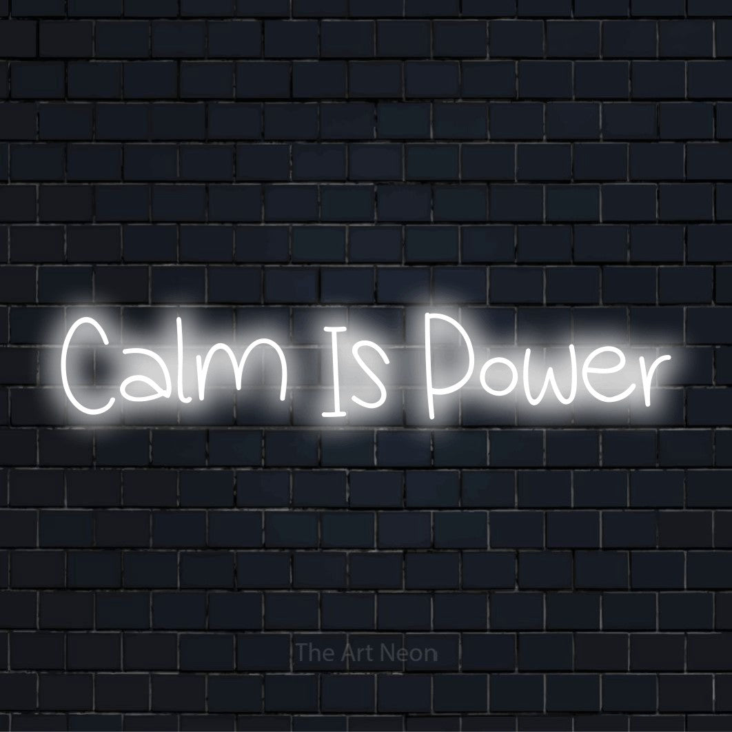 "Calm Is Power" text design with neon effect on a black brick wall