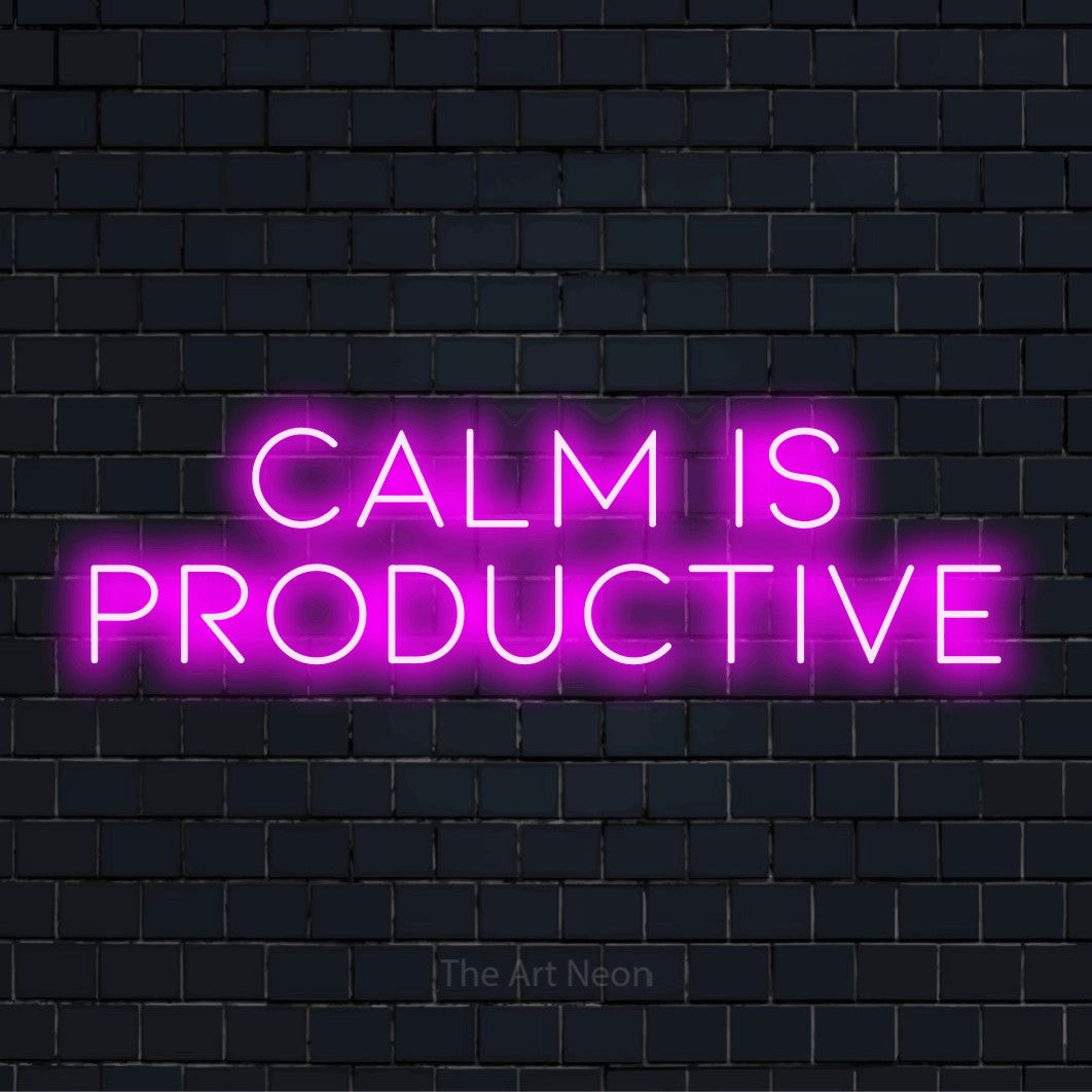 "Calm Is Productive" script-style LED neon sign on a black brick wall
