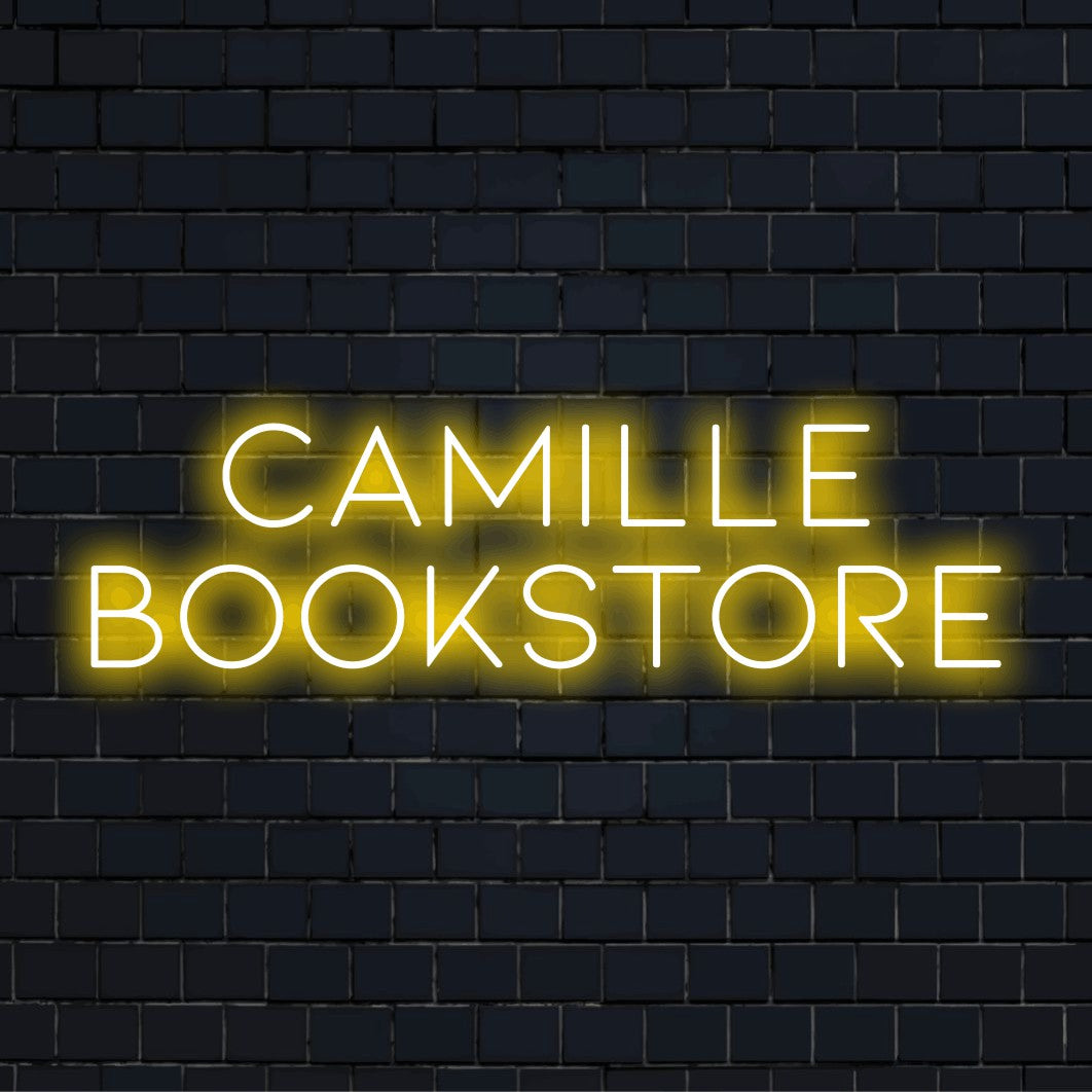Camille Bookstore Personalized LED Neon Sign, bright LED glow against black brick wall