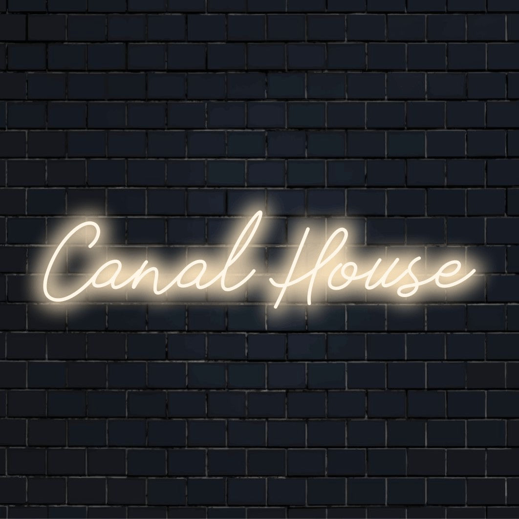 Canal House Neon Sign, bright LED glow against black brick wall