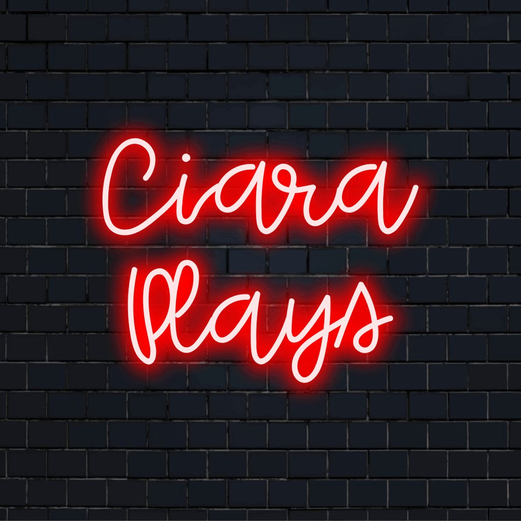 Ciara Plays Personalized Neon Light with bright LED glow on black brick background