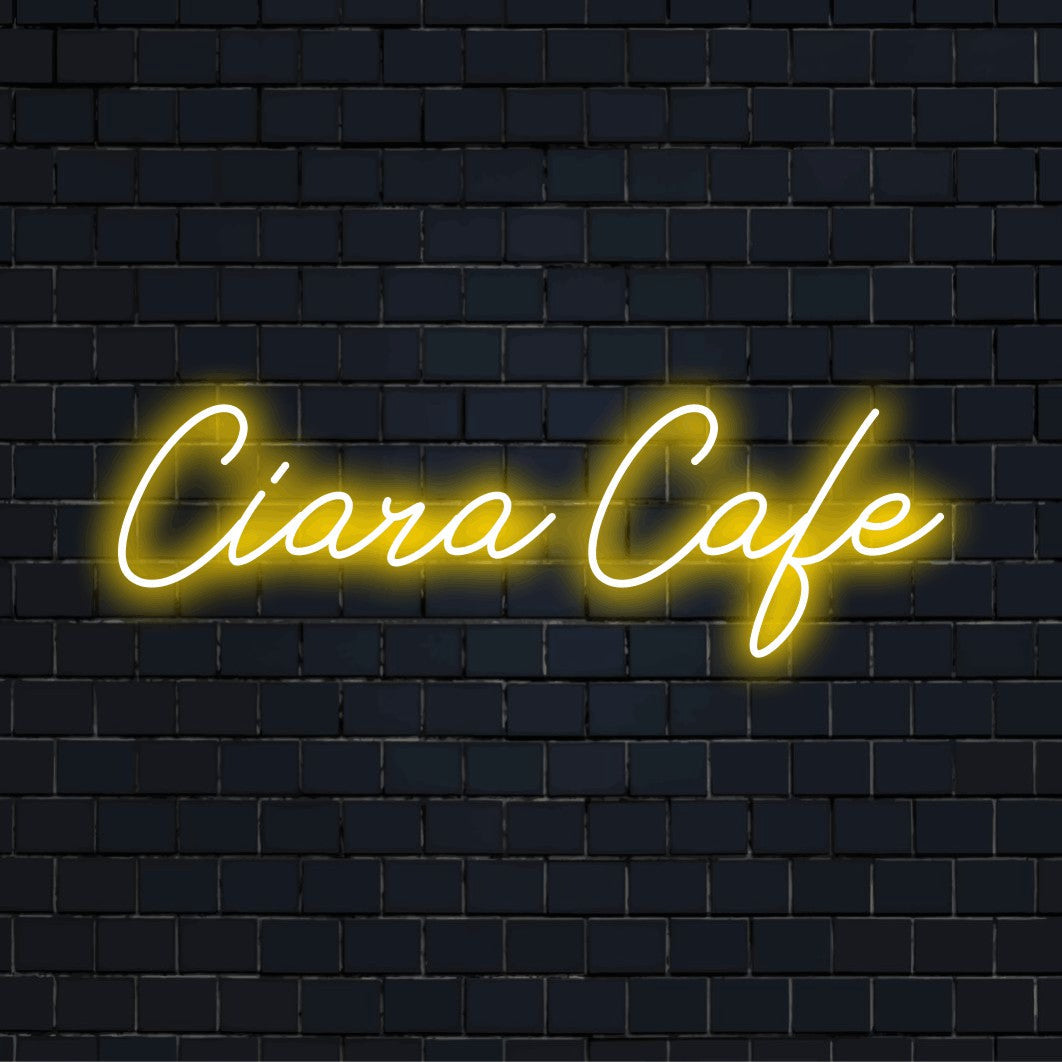 Ciara Cafe Personalized LED Neon Sign, bright LED glow on black brick background
