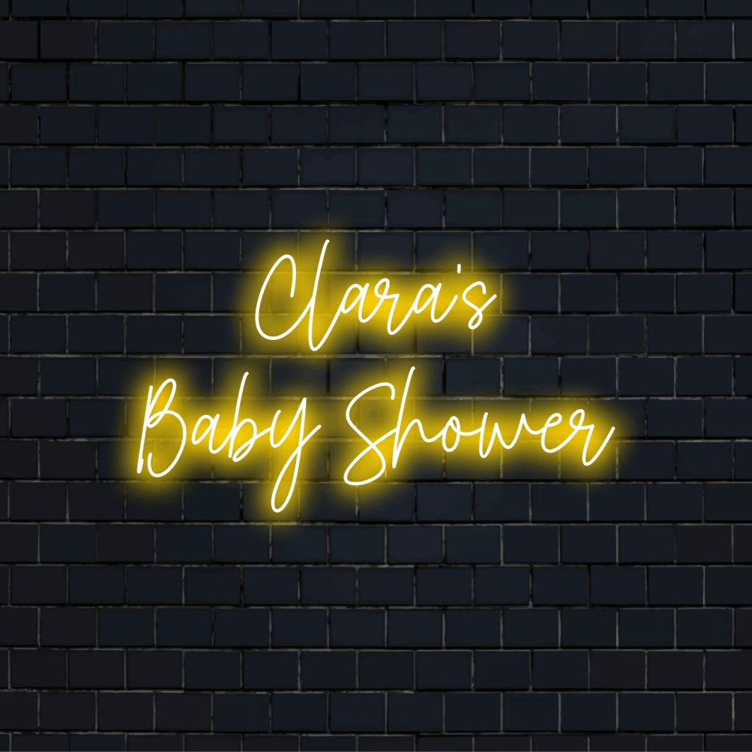 Clara_s Baby Shower Personalized Neon Light with soft neon glow against brick backdrop