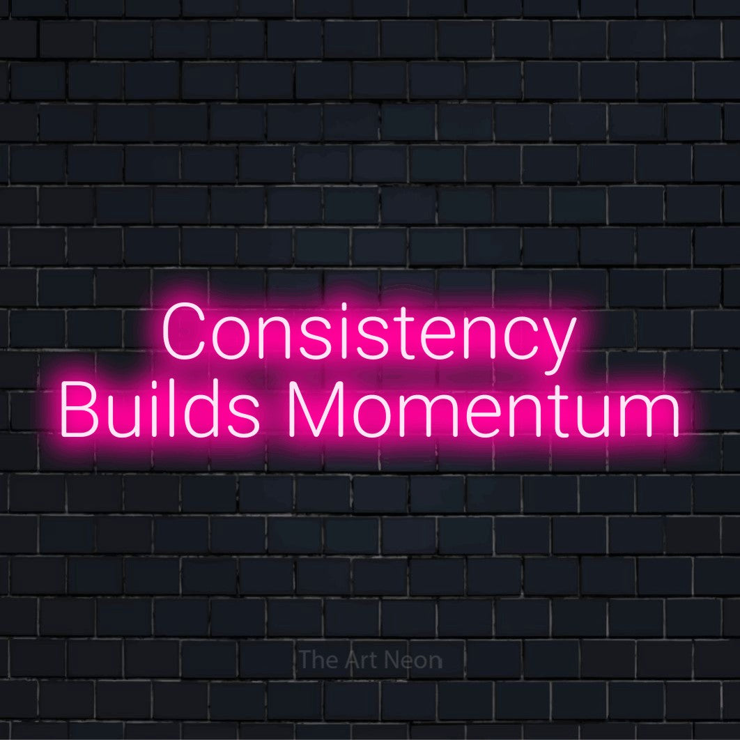 "Consistency Builds Momentum" glowing LED neon sign on a black brick wall