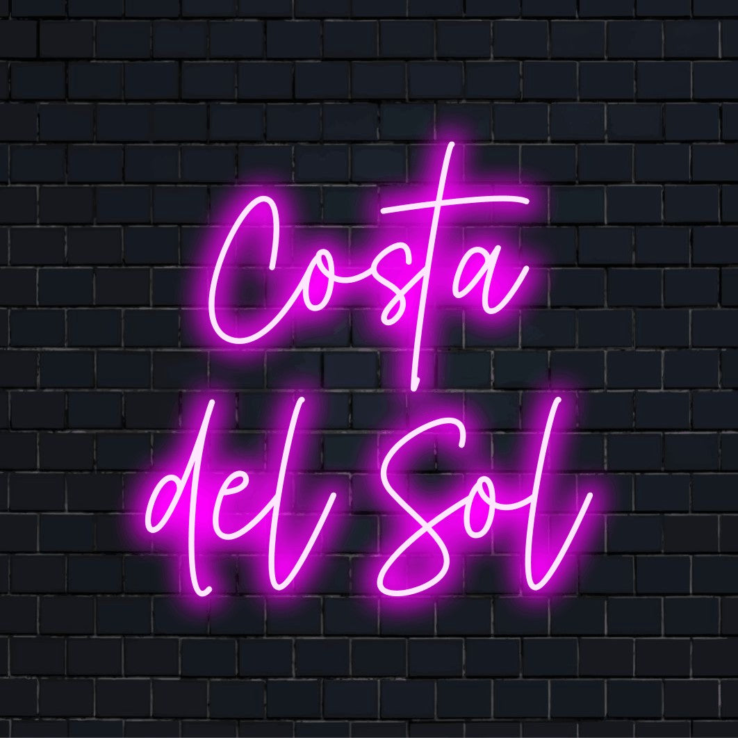 Costa Del Sol Neon Light with glowing wall decor against brick backdrop