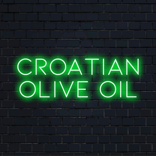 Croatian Olive Oil Neon Light with glowing wall decor against black brick wall