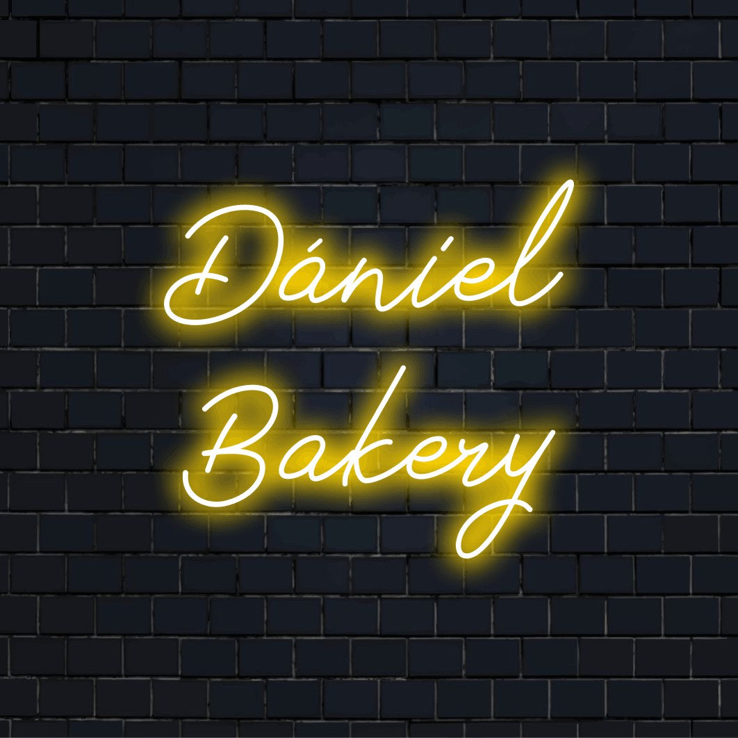Daniel Bakery Custom Name Neon Sign, glowing wall decor on dark brick background