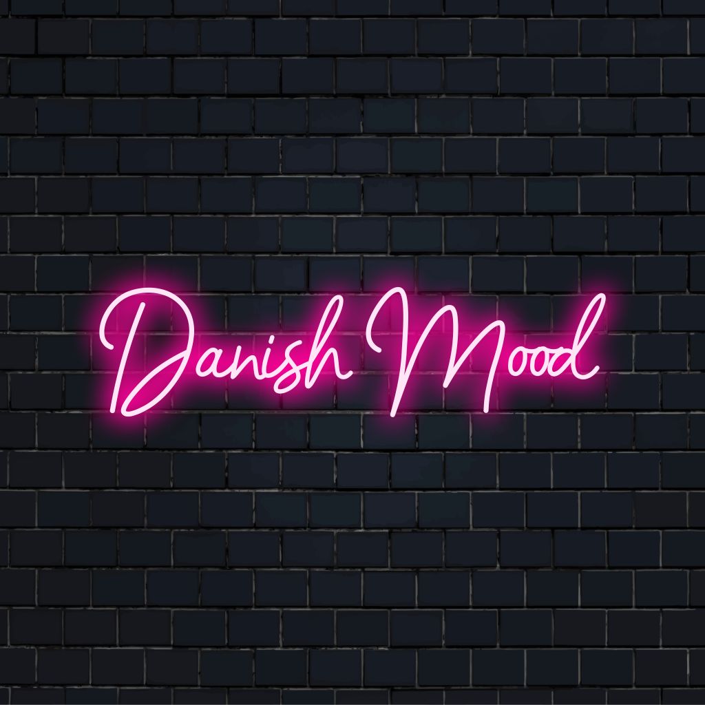 Danish Mood Neon Sign, bright neon lettering against brick backdrop