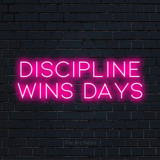 "Discipline Wins Days" neon text design on a black brick wall