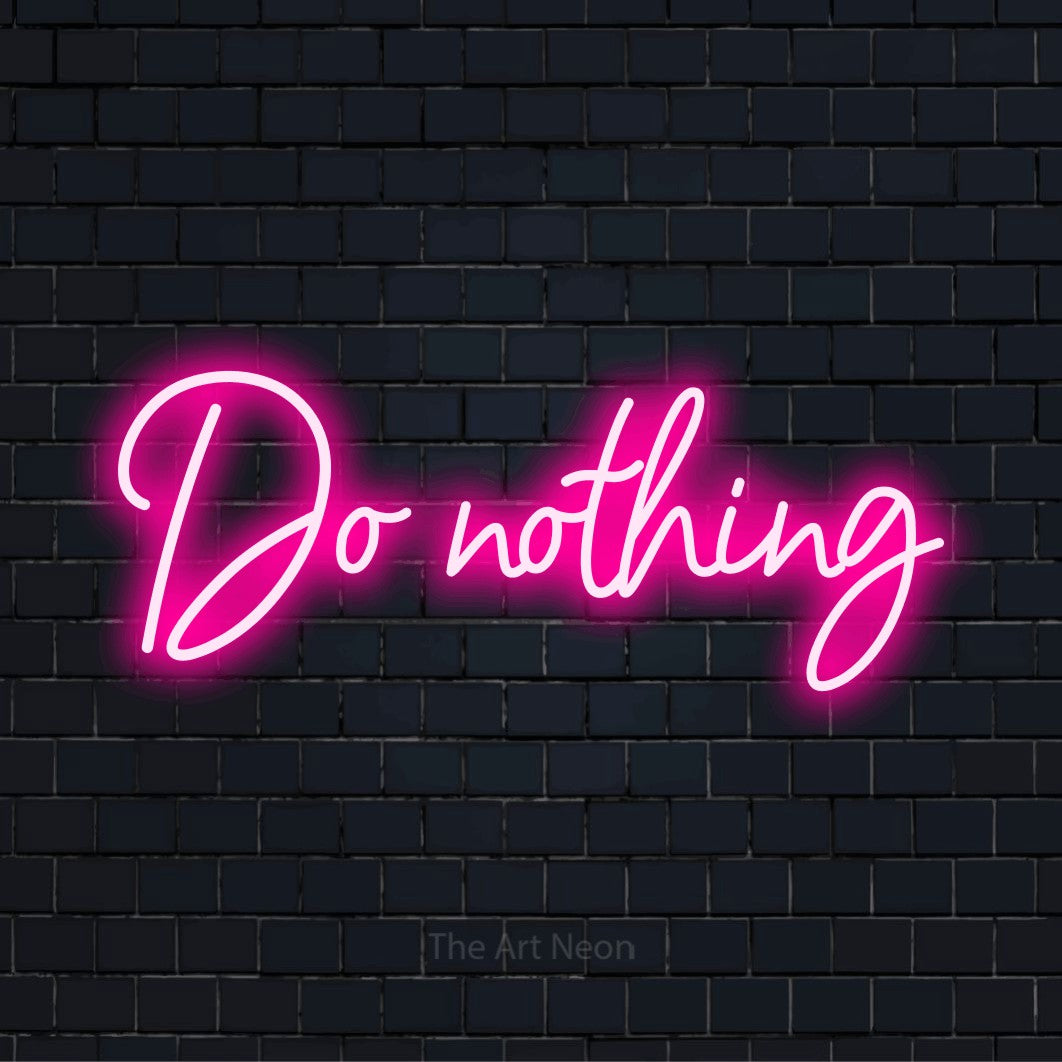 "Do Nothing" neon text design on a black brick wall