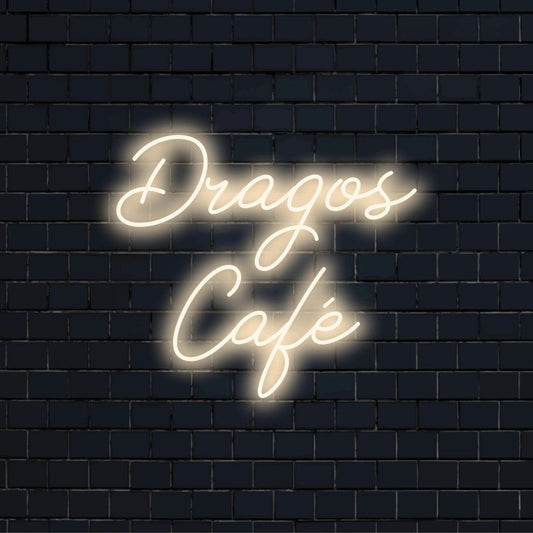 Dragos Cafe Personalized Neon Light with bright neon lettering against brick backdrop