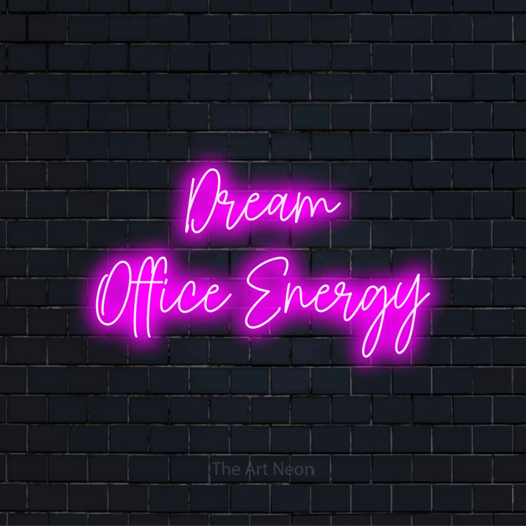 "Dream Office Energy" LED neon sign on a black brick wall